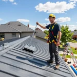 MRoof metal roofing installation scene with professional roofer inspecting quality.